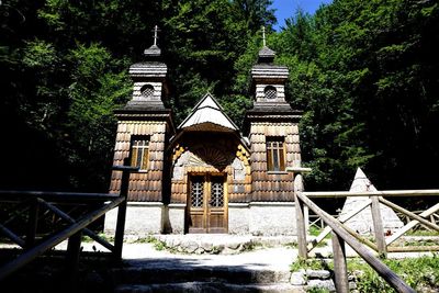 Built structure by building against trees