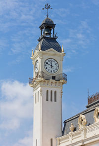 Low angle view of clock tower against sky