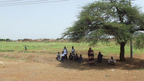 Group of people relaxing on ground