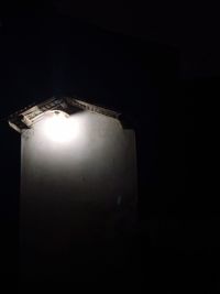 Illuminated lamp in dark room