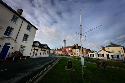 Houses in city against sky