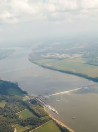 Aerial view of agricultural field against sky