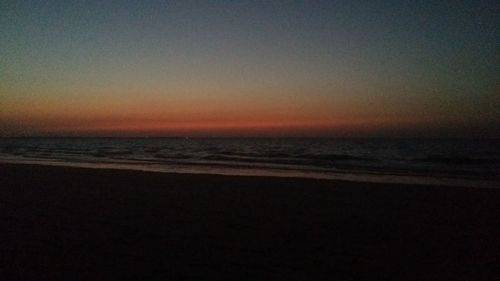 Scenic view of sea against dramatic sky