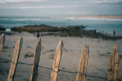 Sandy beach and old fence in bretagne france 