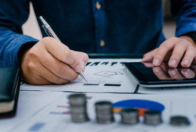 Close-up of business person working in office