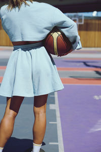 Low section of woman standing in gym