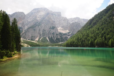 Scenic view of lake and mountains against sky