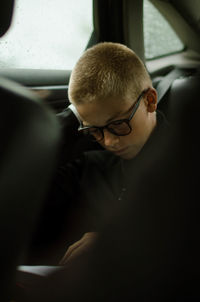 Midsection of man sitting in car