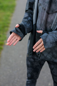 Midsection of man holding hands
