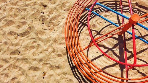 High angle view of wicker basket on sand