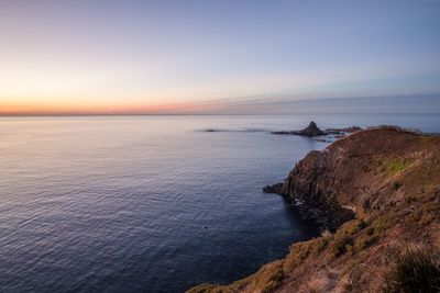 Scenic view of sea against sky at sunset