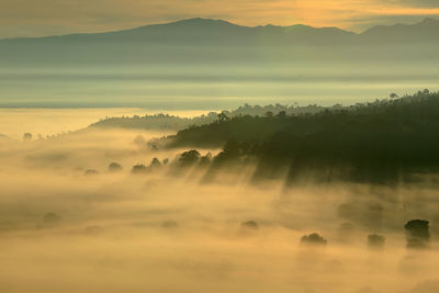 Scenic view of mountains against sky during sunset