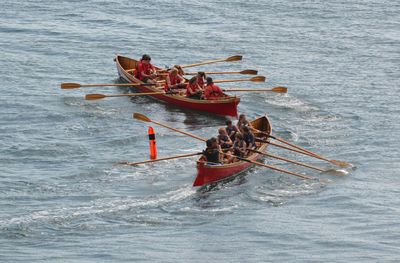 High angle view of people in boat on sea