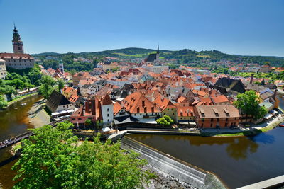 High angle view of buildings in town against sky