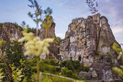 Low angle view of rocks against sky