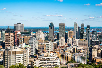 Modern buildings in city against sky