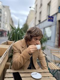 Portrait of man drinking coffee