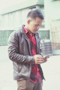 Young man using mobile phone