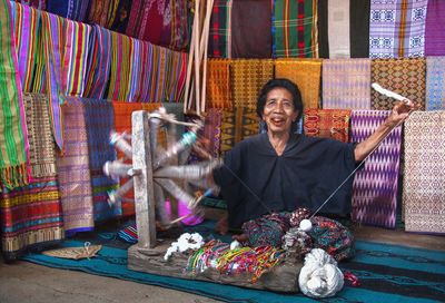 Portrait of smiling woman working in workshop