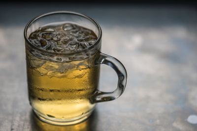 Close-up of beer glass on table