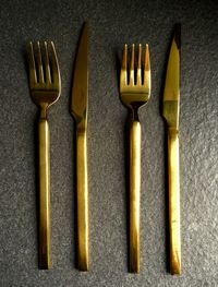 Close-up of fork and knives on table 