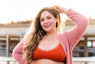 Portrait of young curvy woman outdoors