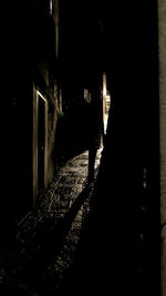 Silhouette man standing in abandoned building