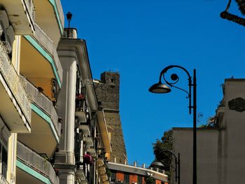 Low angle view of buildings against blue sky