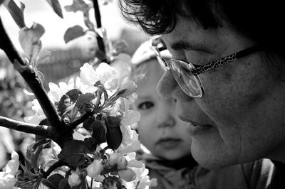 Grandmother with grandchild by flowers