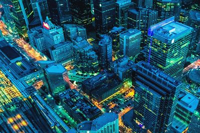 High angle view of city lit up at night