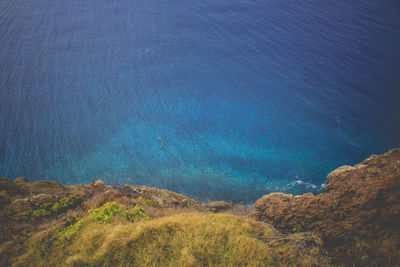 High angle view of sea against blue sky