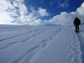 Full length of man on snow covered landscape