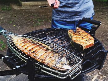 Cooking fish on barbeque metal grate