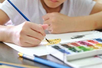 Close-up of woman hand on table