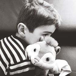 Close-up of cute boy with toy