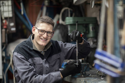 Plumber male working in a workshop