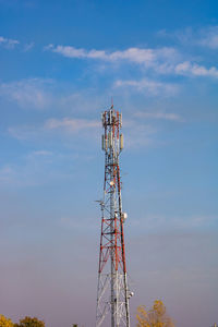 Low angle view of communications tower against sky