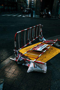 View of abandoned car on street in city