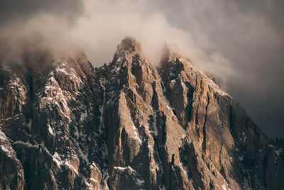 Low angle view of rock formation against sky