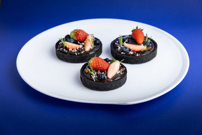 Close-up of fruits served in plate