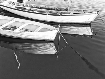 High angle view of small fishing boats moored in harbor