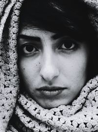 Close-up portrait of young woman wearing headscarf