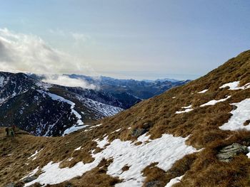 Scenic view of snowcapped mountains against sky