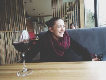 Mid adult woman sitting at table