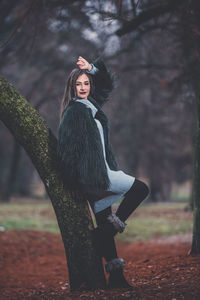 Woman looking at camera in forest