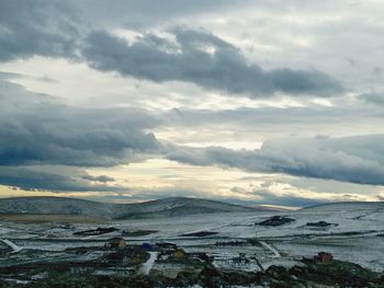 Scenic view of sea against cloudy sky