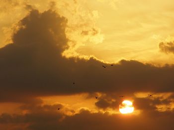 Low angle view of cloudy sky at sunset