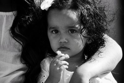 Portrait of cute girl with mother