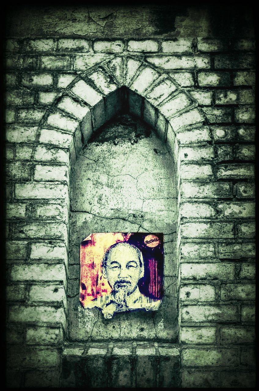 architecture, transfer print, built structure, wall - building feature, brick wall, auto post production filter, graffiti, building exterior, art and craft, door, wall, art, old, creativity, arch, entrance, weathered, stone wall, closed, red