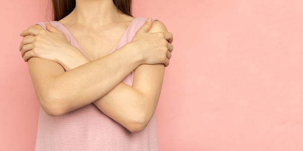 Low section of woman holding gift